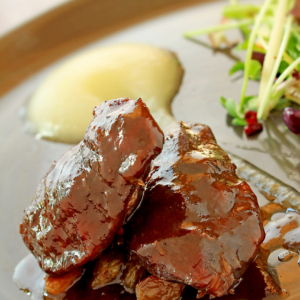 braised pig cheeks plated meal